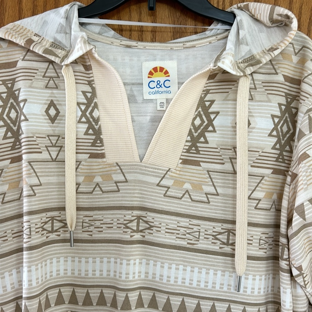 Super cute & casual Southwest print long sleeve hooded tunic. Never worn. Size M